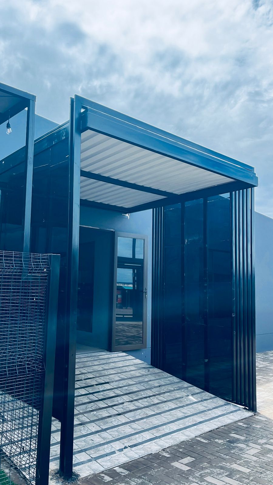 Architectural steel canopy over public entrance