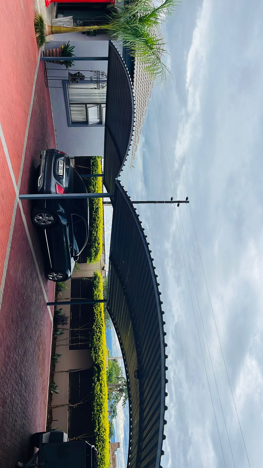 Steel carport with roof covering